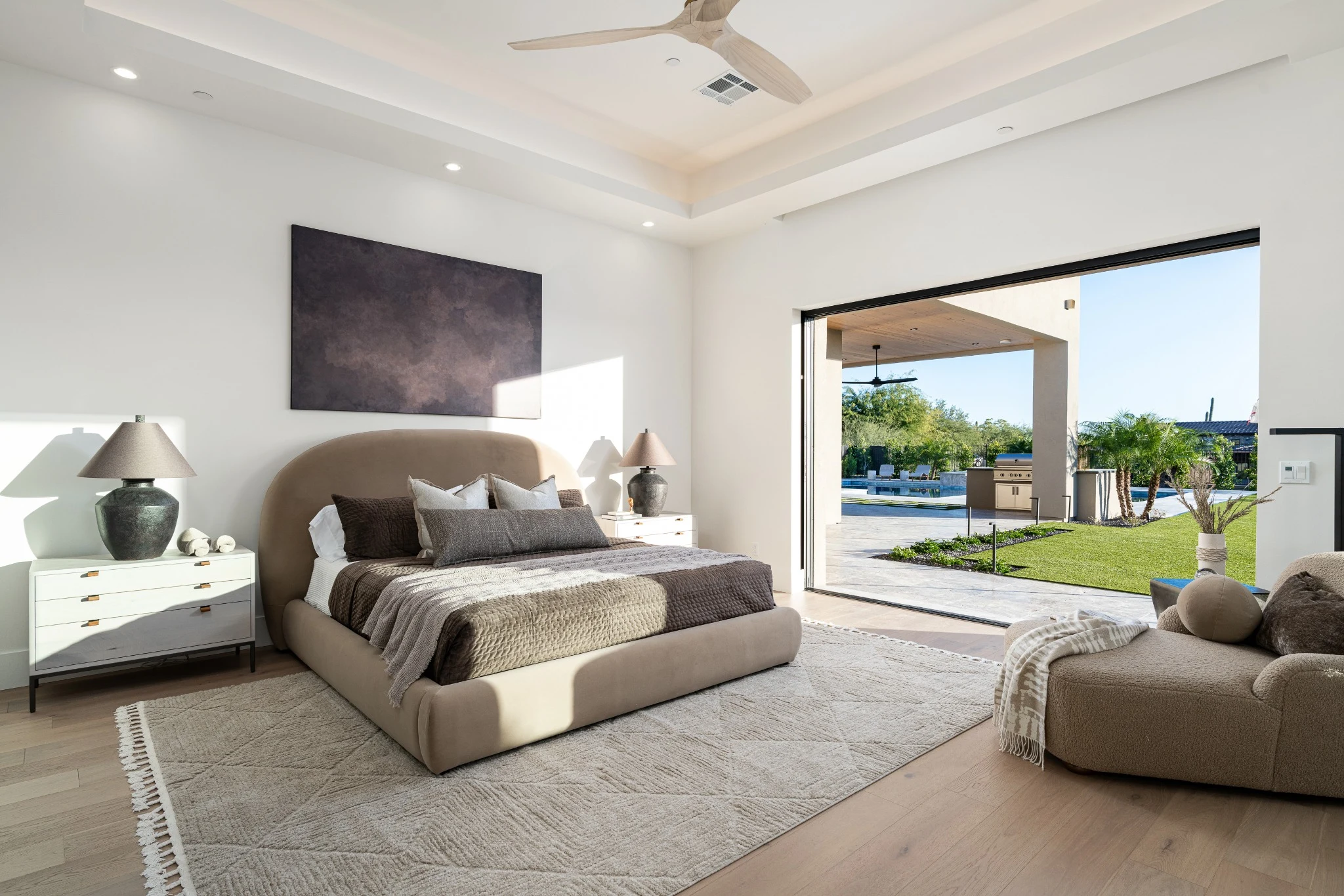 Restful bedroom with natural tones and open garden views